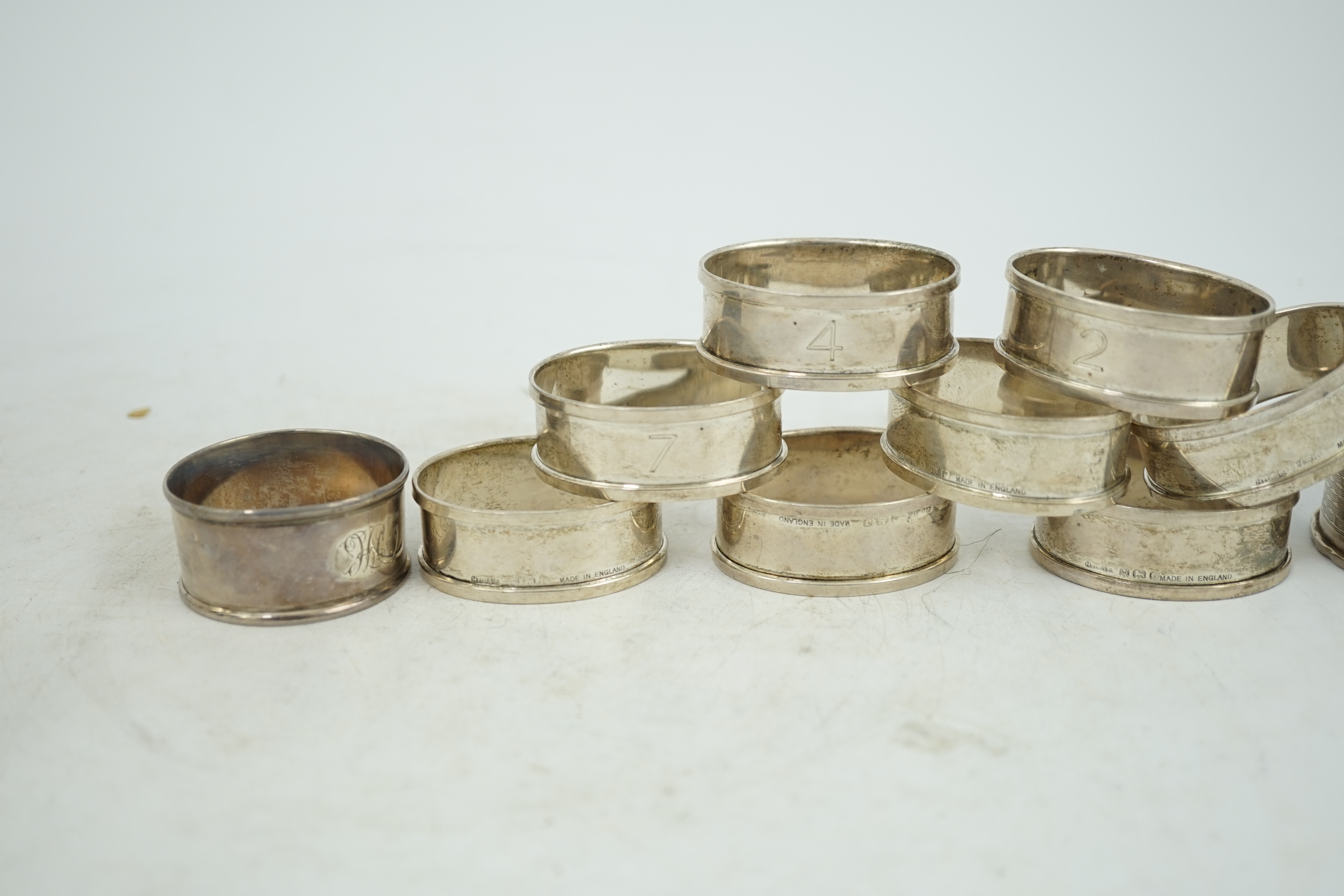 A matched set of eight early 1930's silver napkin rings and four other silver napkin rings including a pair, Birmingham, 1929, 5.3oz.